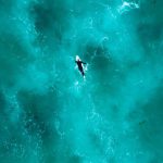 Silfra Diving - Aerial Photography of Person Surfing