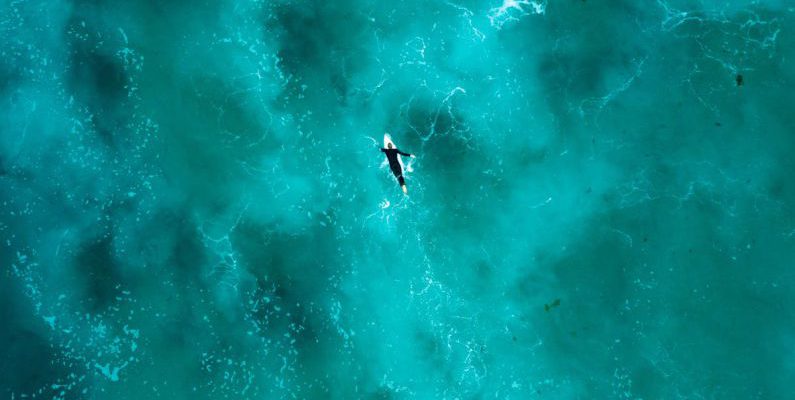 Silfra Diving - Aerial Photography of Person Surfing