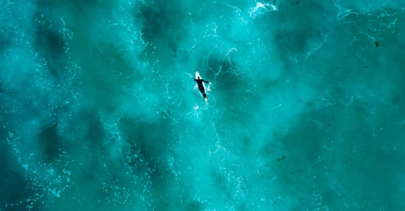 Silfra Diving - Aerial Photography of Person Surfing