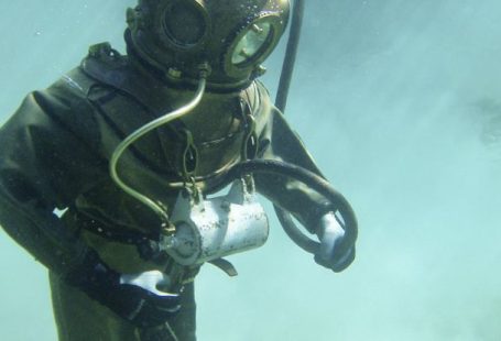 Deep Diving - Person in Green Scuba Diving Suit