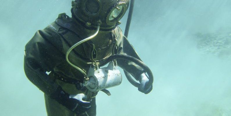 Deep Diving - Person in Green Scuba Diving Suit