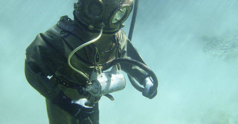 Deep Diving - Person in Green Scuba Diving Suit