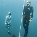 Freediving Fins - Breath-holding Diver Emerging Under the Supervision of Another Freediver