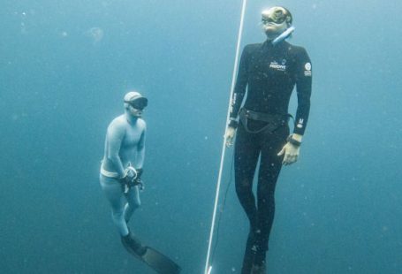 Freediving Fins - Breath-holding Diver Emerging Under the Supervision of Another Freediver