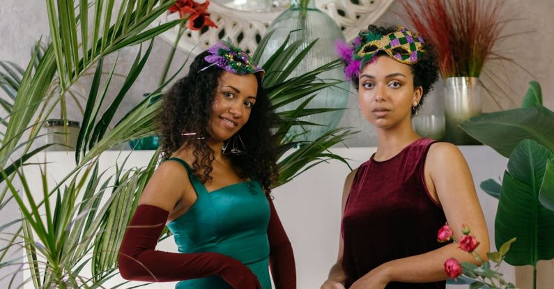 Masks Glasses - Photo of Women in Dresses Posing Near a Table