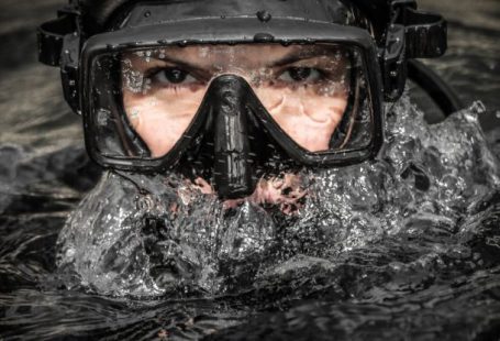 Galapagos Diving - A man wearing a scuba mask and goggles in the water
