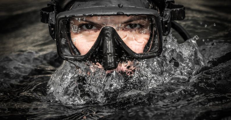 Galapagos Diving - A man wearing a scuba mask and goggles in the water