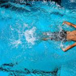 Buoyancy Diving - Person Swimming on Body of Water