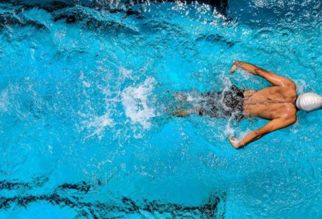 Buoyancy Diving - Person Swimming on Body of Water