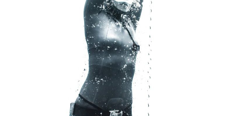 Ascend Diving - Low angle of anonymous female diver wearing swimsuit and snorkeling mask and diving under clear water near rope among air bubbles