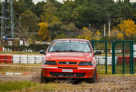 Drift Diving - A car is driving on a dirt track
