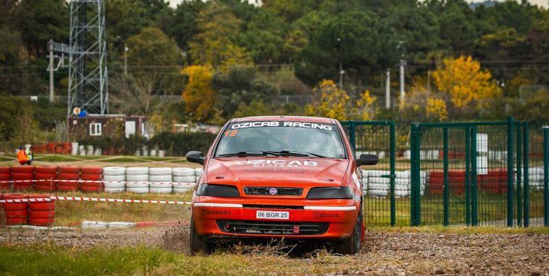 Drift Diving - A car is driving on a dirt track