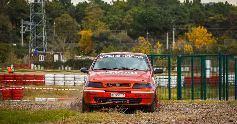 Drift Diving - A car is driving on a dirt track