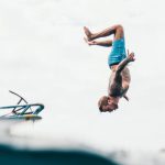 Rescue Diving - Man Wearing Blue Shorts About to Dive on Body of Water