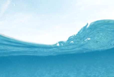 Snorkeling Transition - Man Diving on Body of Water