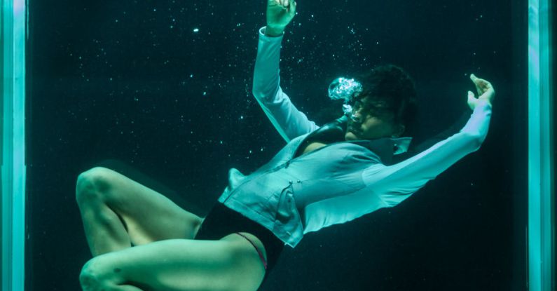 Seahorse Diving - Person Wearing White Long-sleeved Shirt in Underwater