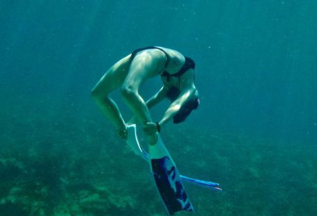Bonaire Diving - A person swimming in the ocean with a snorkel