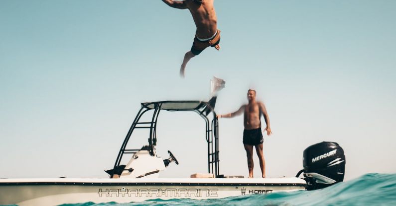 First Dive - Photo of Man Jumping from Boat to the Sea