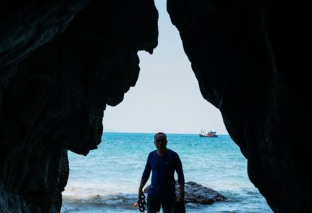 Cave Diving - Man in Diving Suit Standing on Beach
