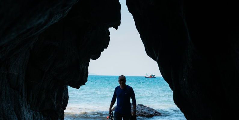 Cave Diving - Man in Diving Suit Standing on Beach